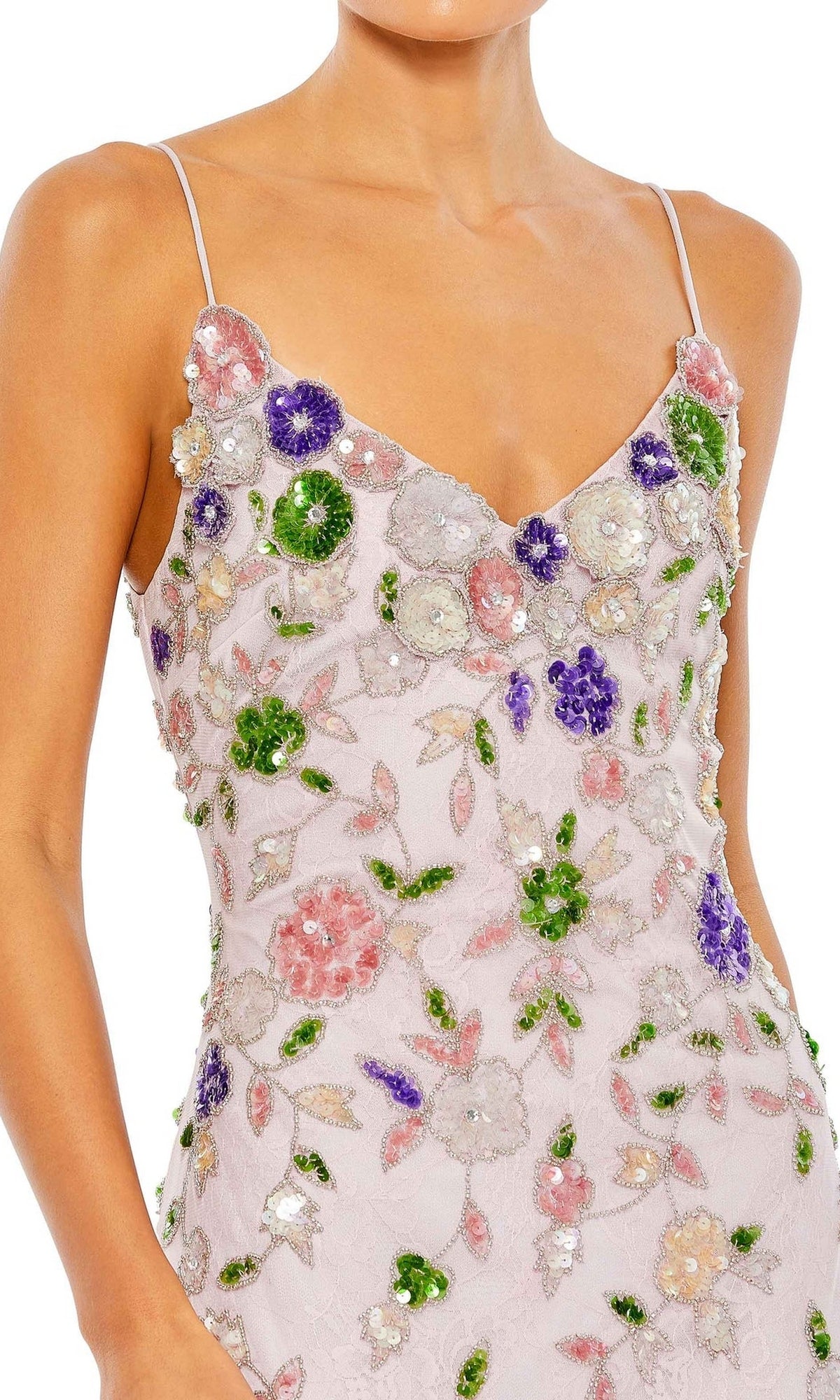 A woman wearing the Long Formal Dress 10893 by Mac Duggal, a fitted formal gown with thin straps and pink, green, and purple floral embroidery on light fabric.